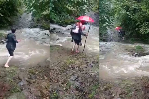 Azərbaycanda ata övladını məktəbə belində aparır - VİDEO